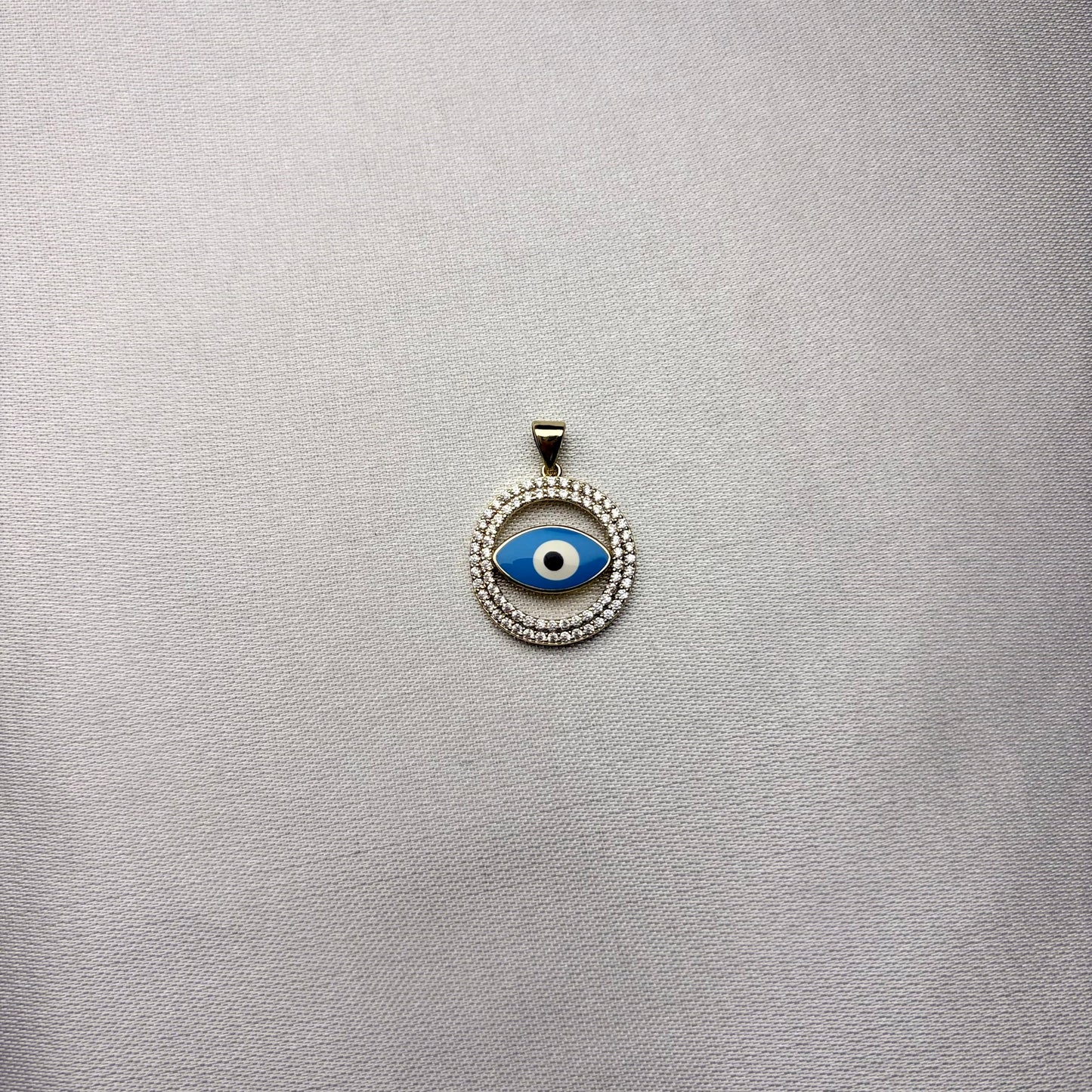 Dije Ojo Celestial laminado en oro 14K